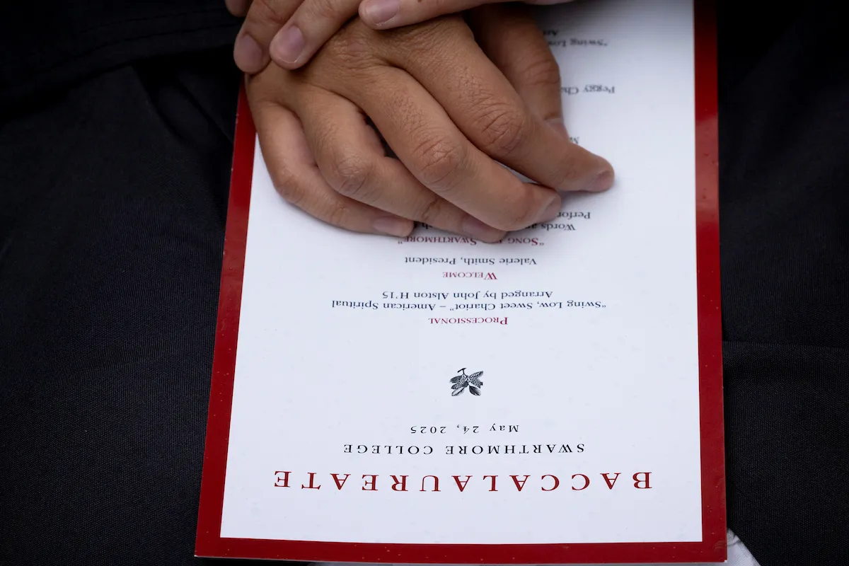 hands over program during baccalaureate
