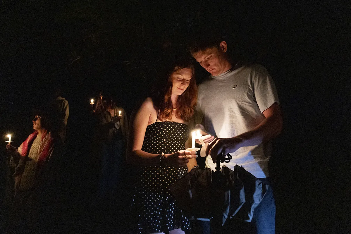 Students convene with candles for last collection ceremony