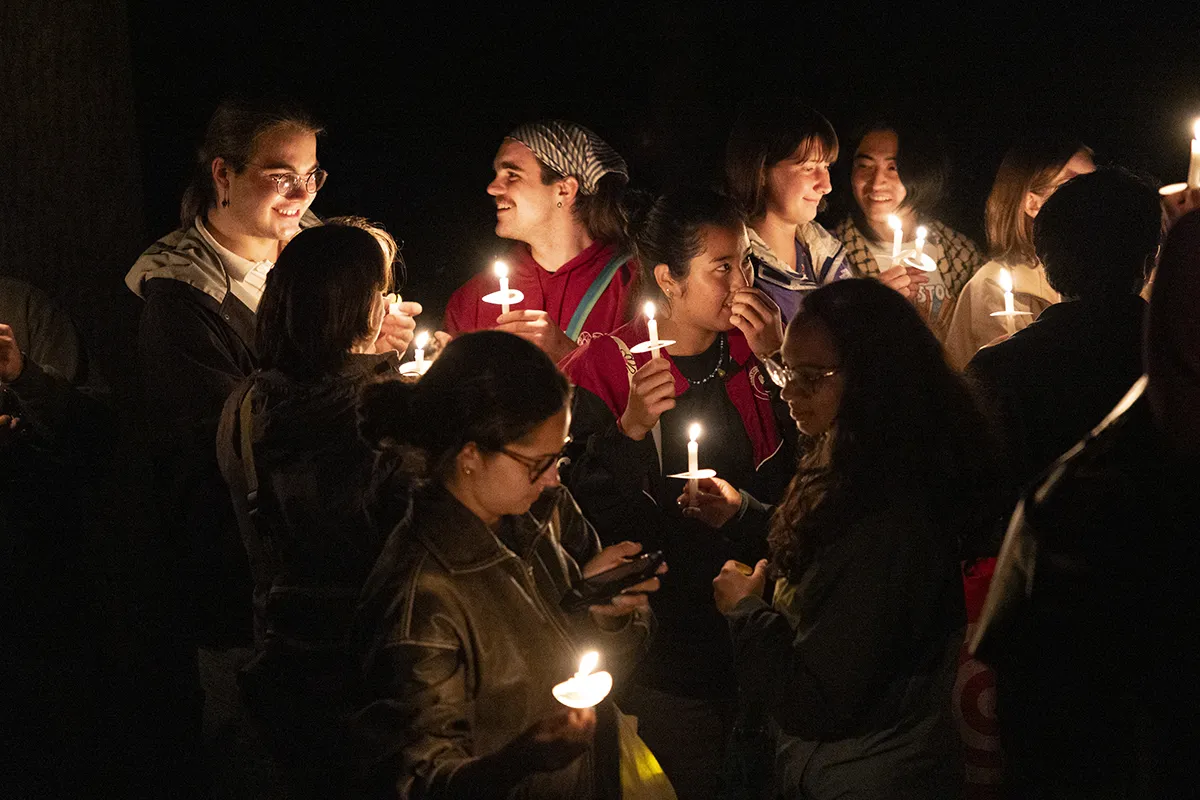 Students convene with candles for last collection ceremony