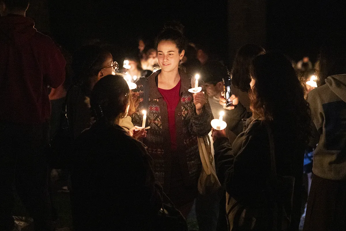 Students convene with candles for last collection ceremony