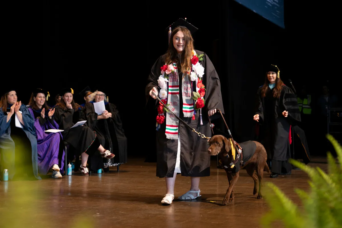 Rose West '26 and guide dog, Nara