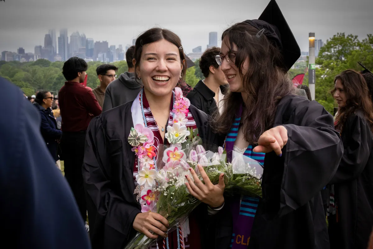 Students talk during post graduation reception