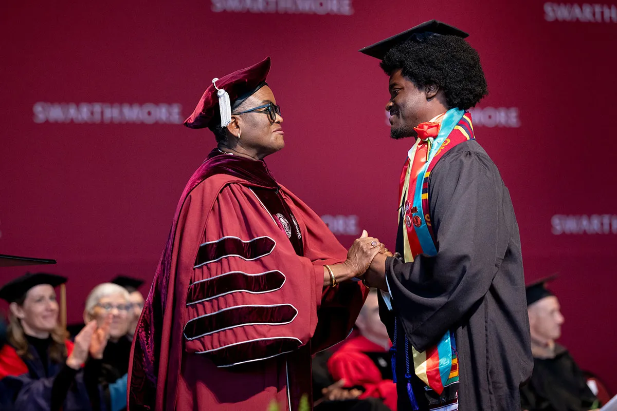 Val Smith with student at commencement