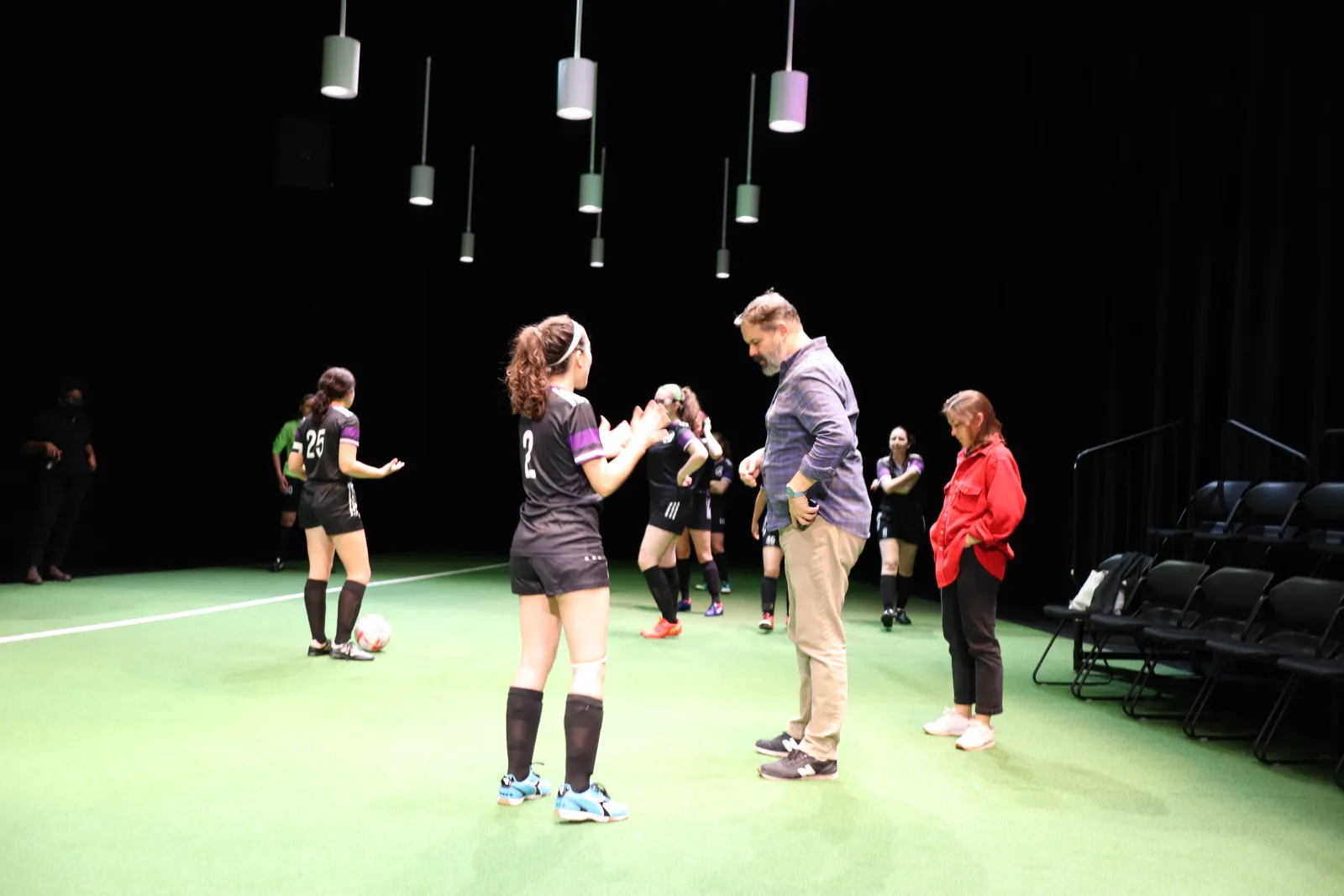Director Alex Torra gives notes to student actors.