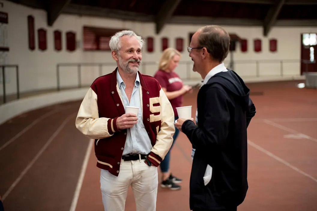 People talk in Lamb Miller Fieldhouse