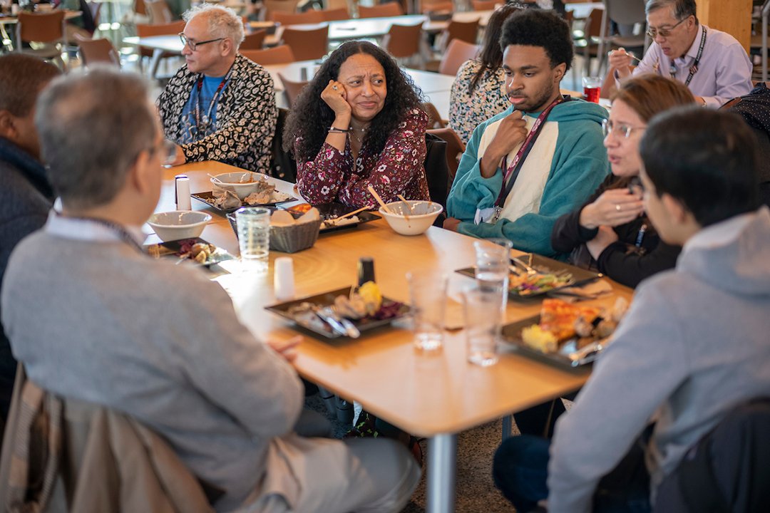 Group of people eat meal in Dining Center