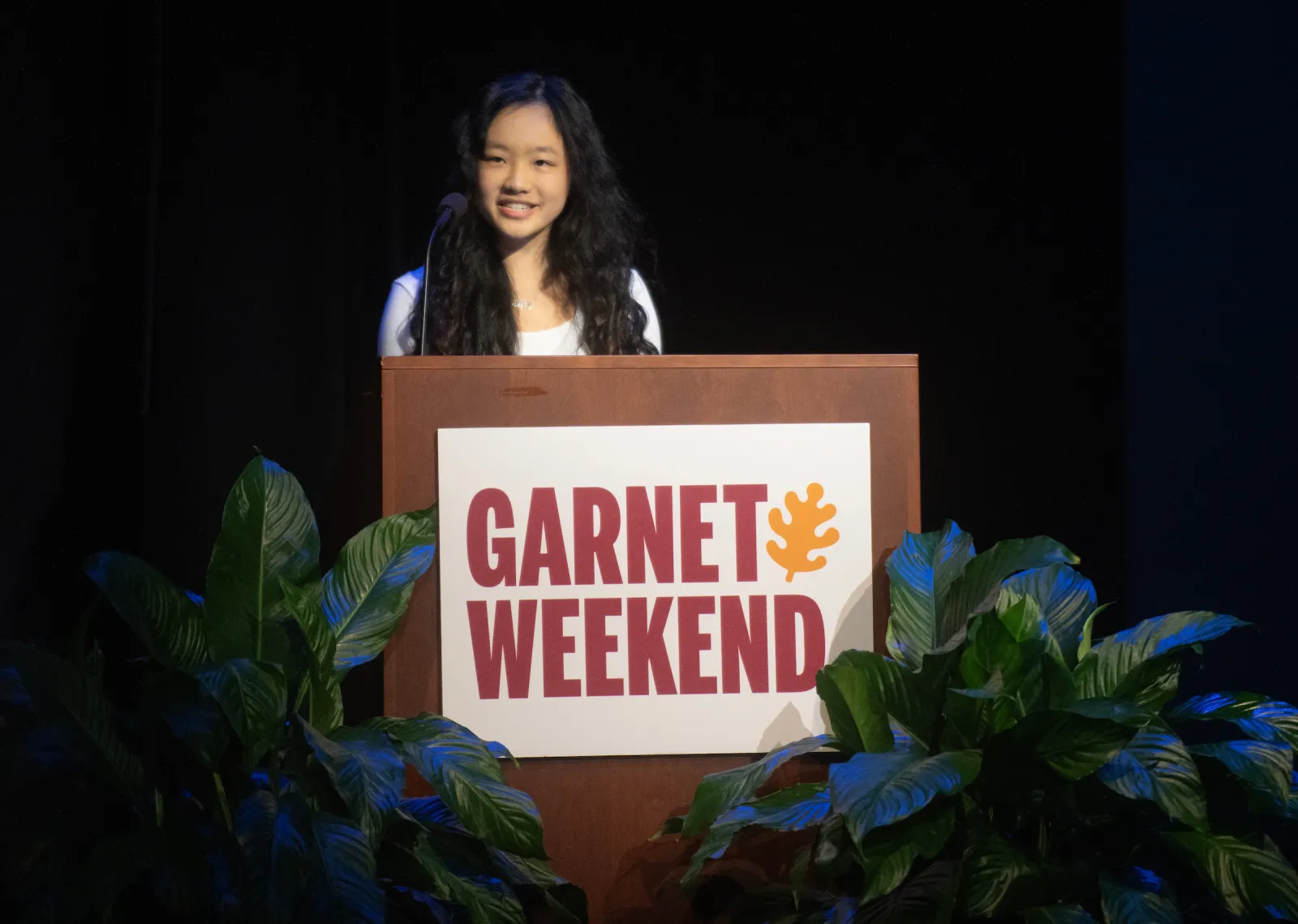 Student speaks at Garnet Weekend podium