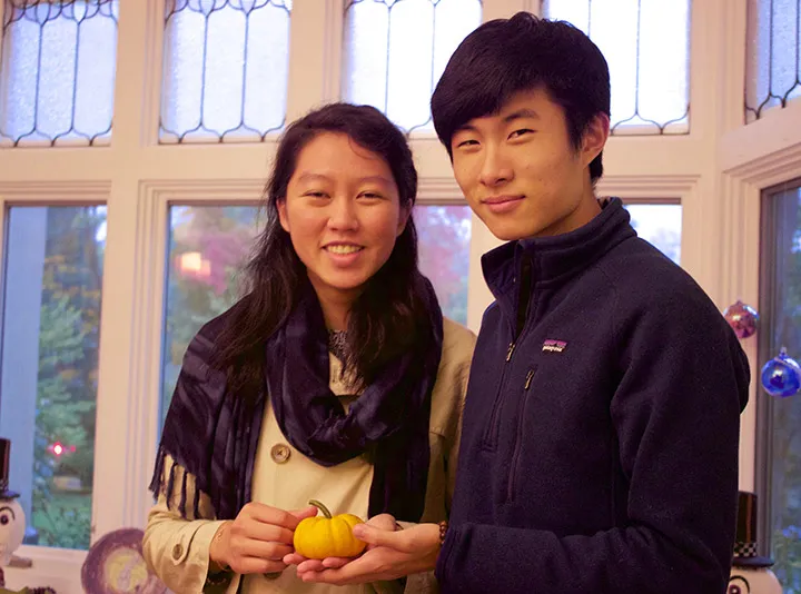 Two students with a pumpkin