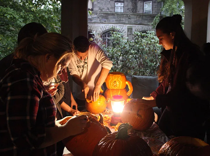 Students carve pumpkins