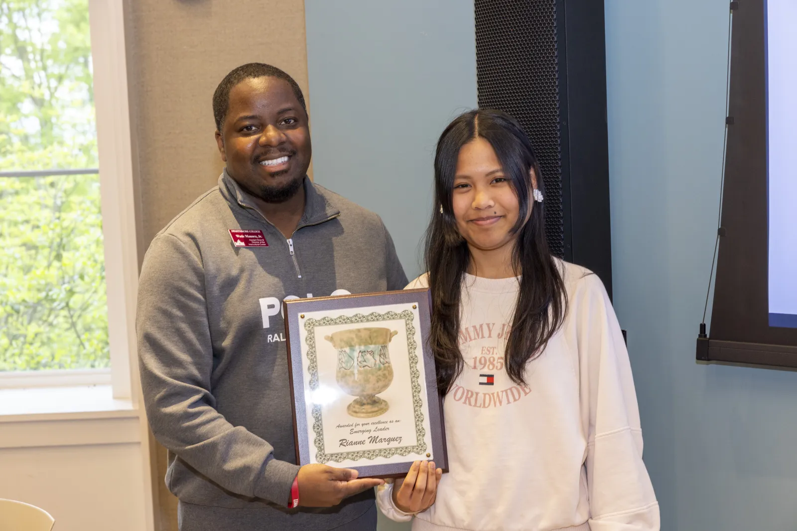 Awardee and Director smiling for a picture