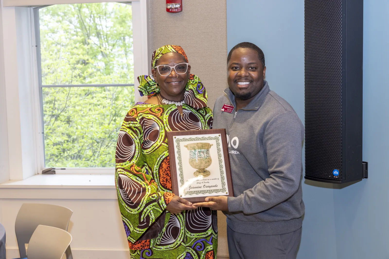 Awardee and Director smiling for a picture