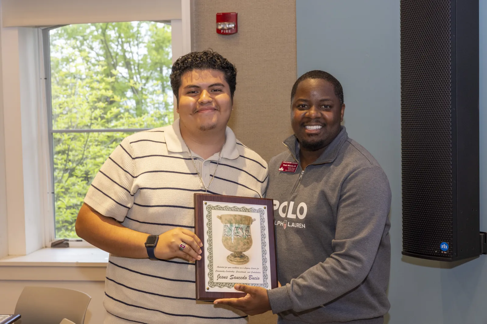 Awardee and Director smiling for a picture