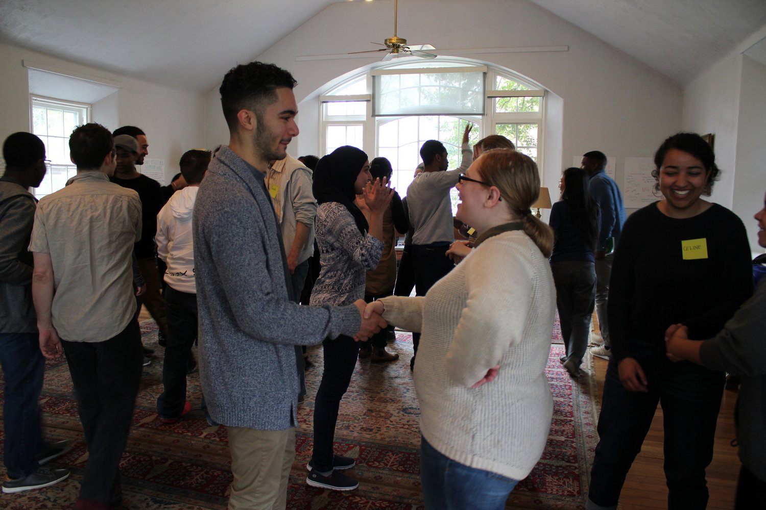 People shaking hands at Kayhan Irani workshop