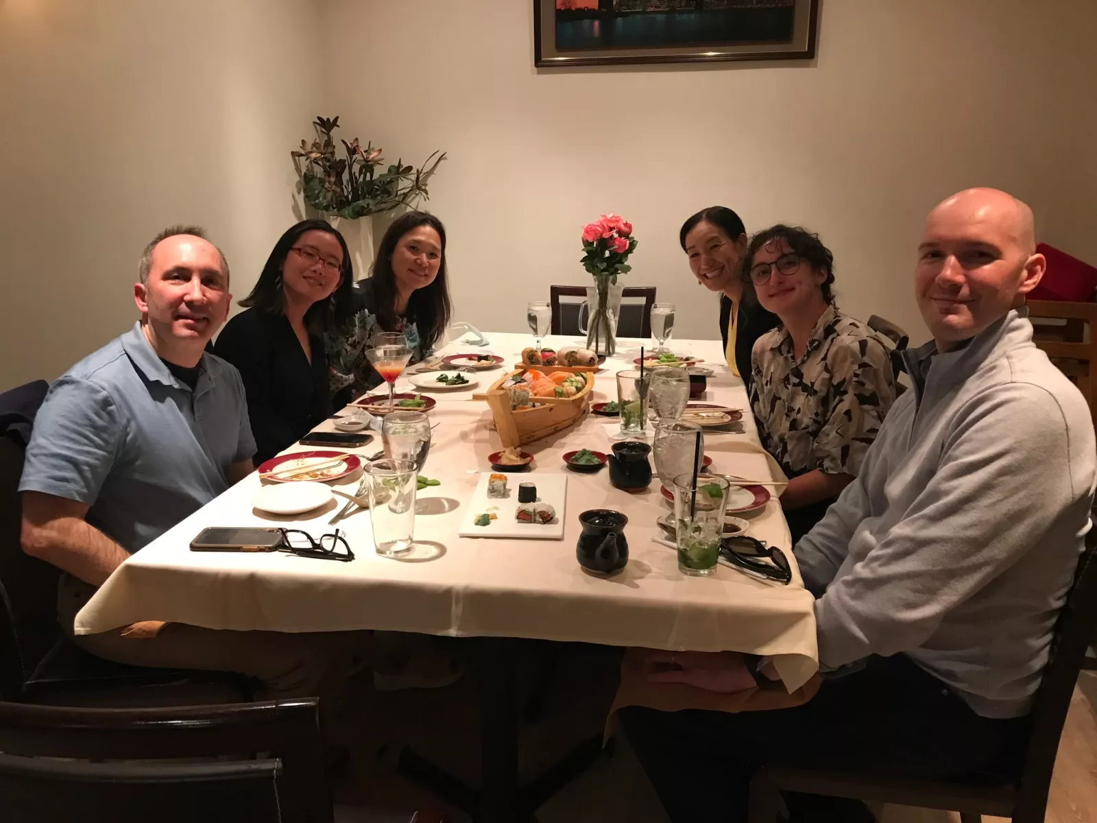 Photo of students and faculty of the Japanese language program at a sushi restaurant.