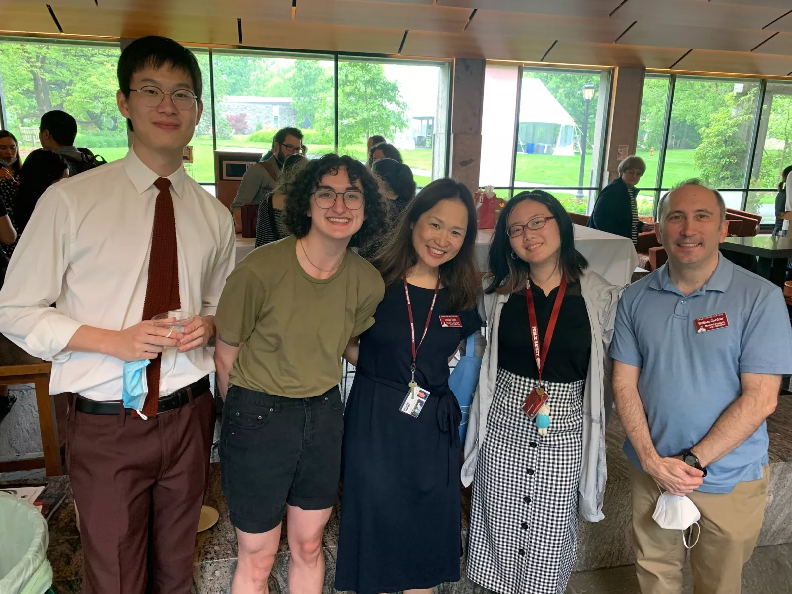 Photo of four graduating Japanese language students and the section head, Will Gardner