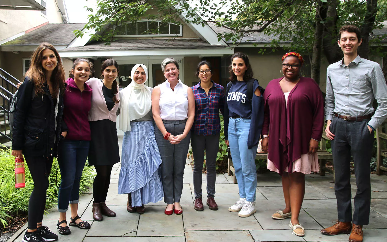 Fellows standing outside of the Lang Center