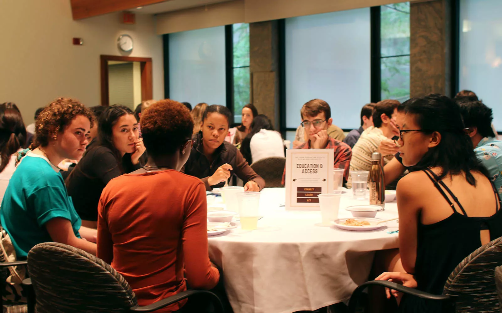 Group of people seated around a table at the Lang Center