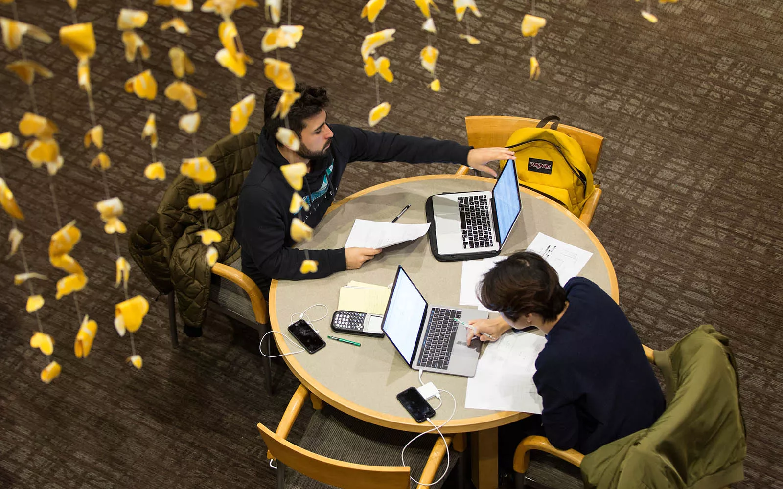 two students at round table from above