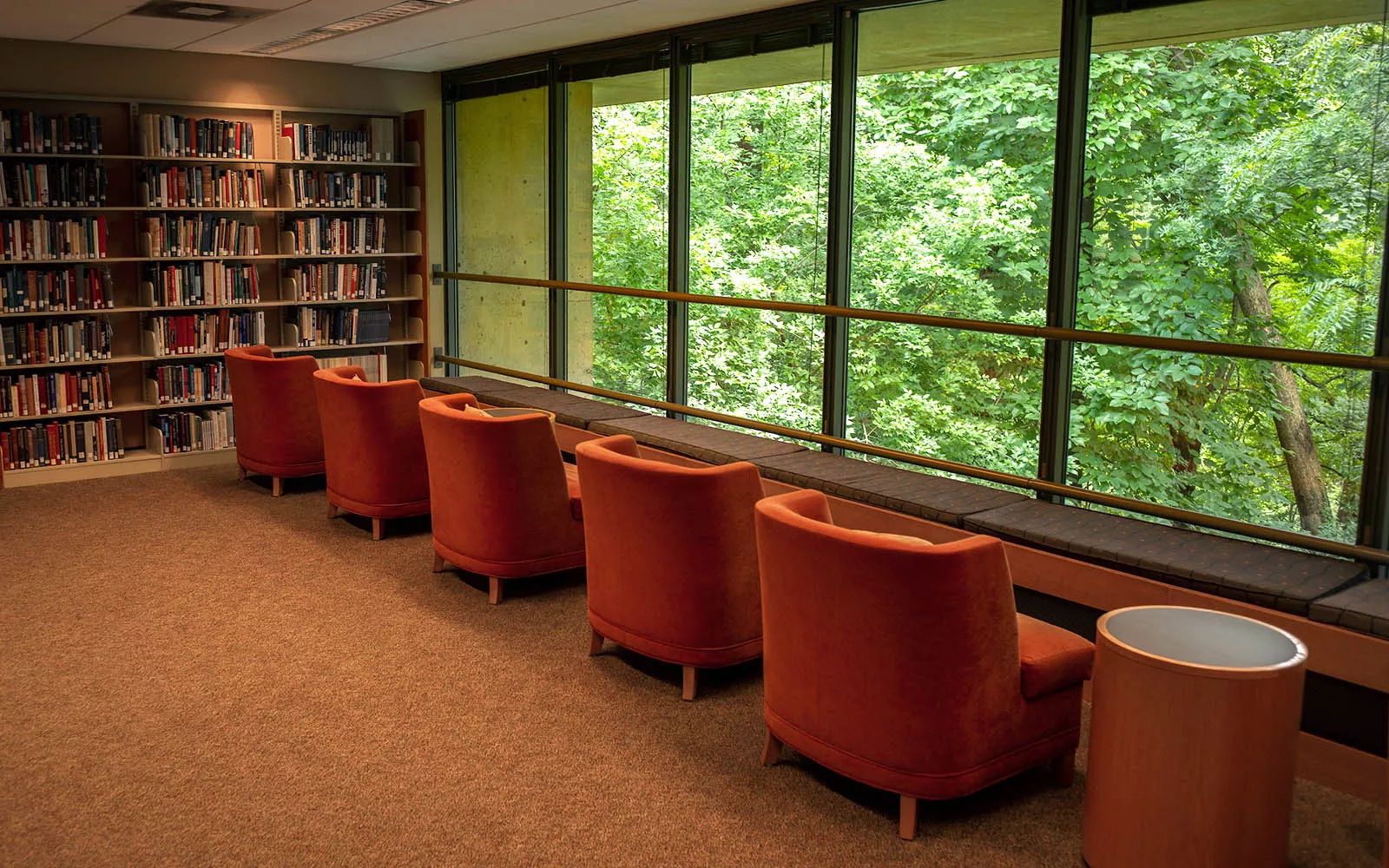 row of chairs facing tall windows