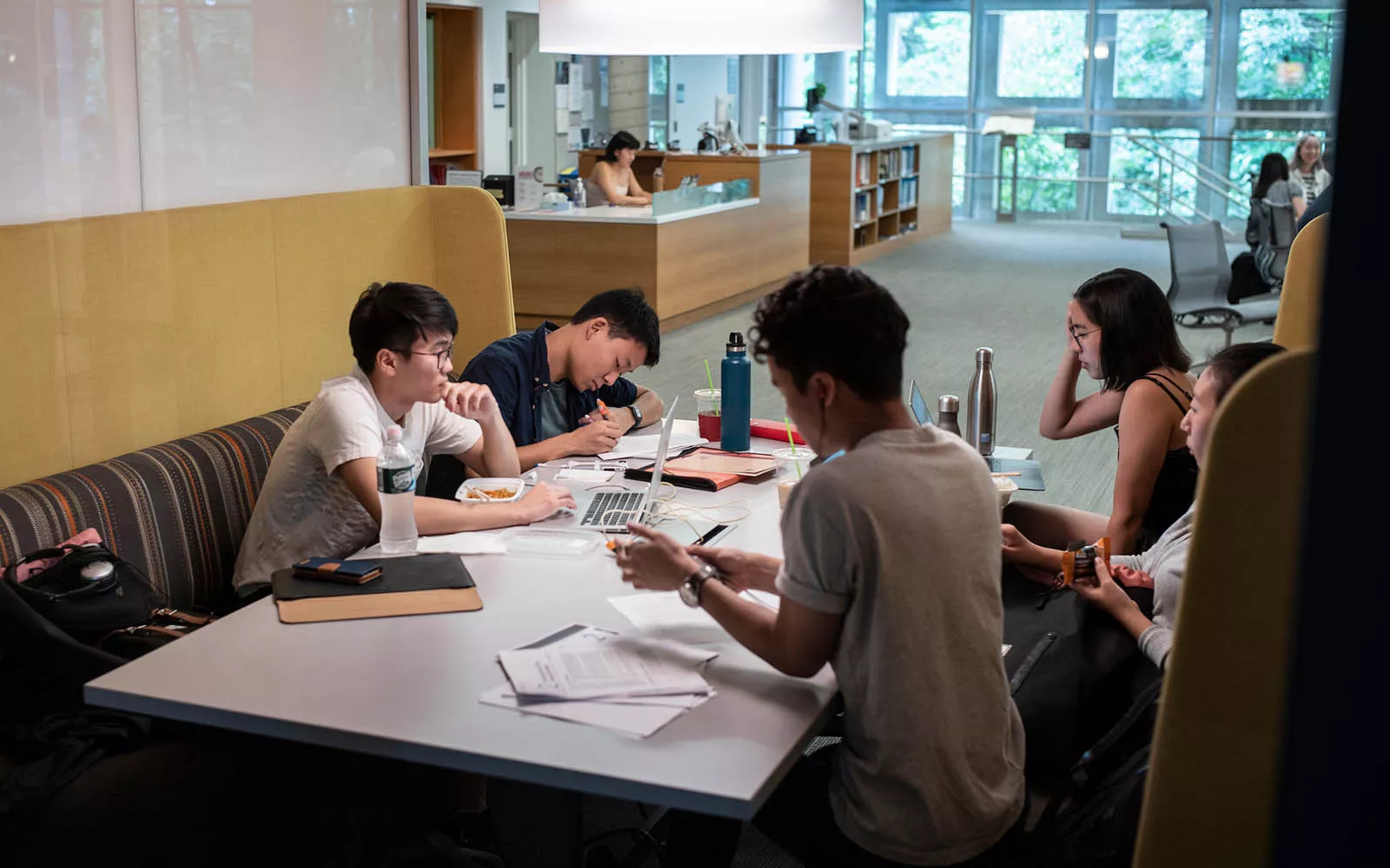 students sitting in a booth