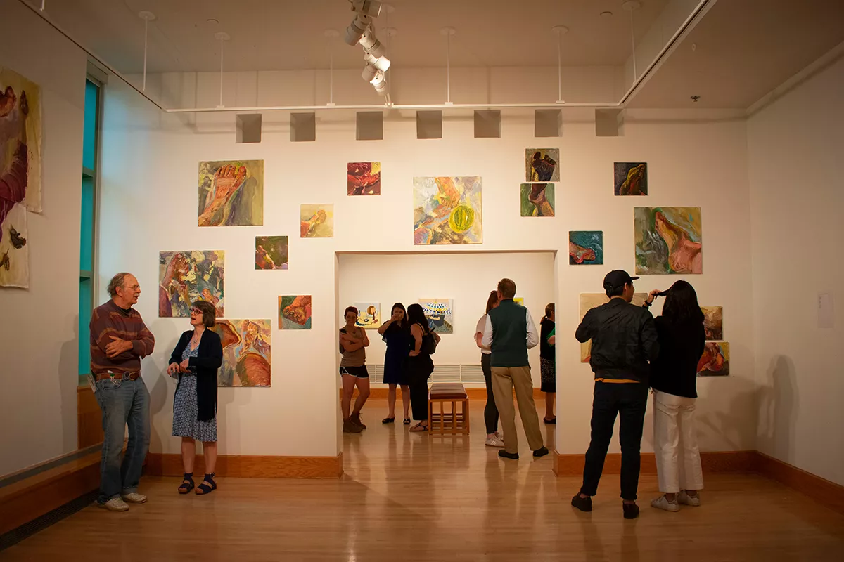 Visitors examine art in List Gallery