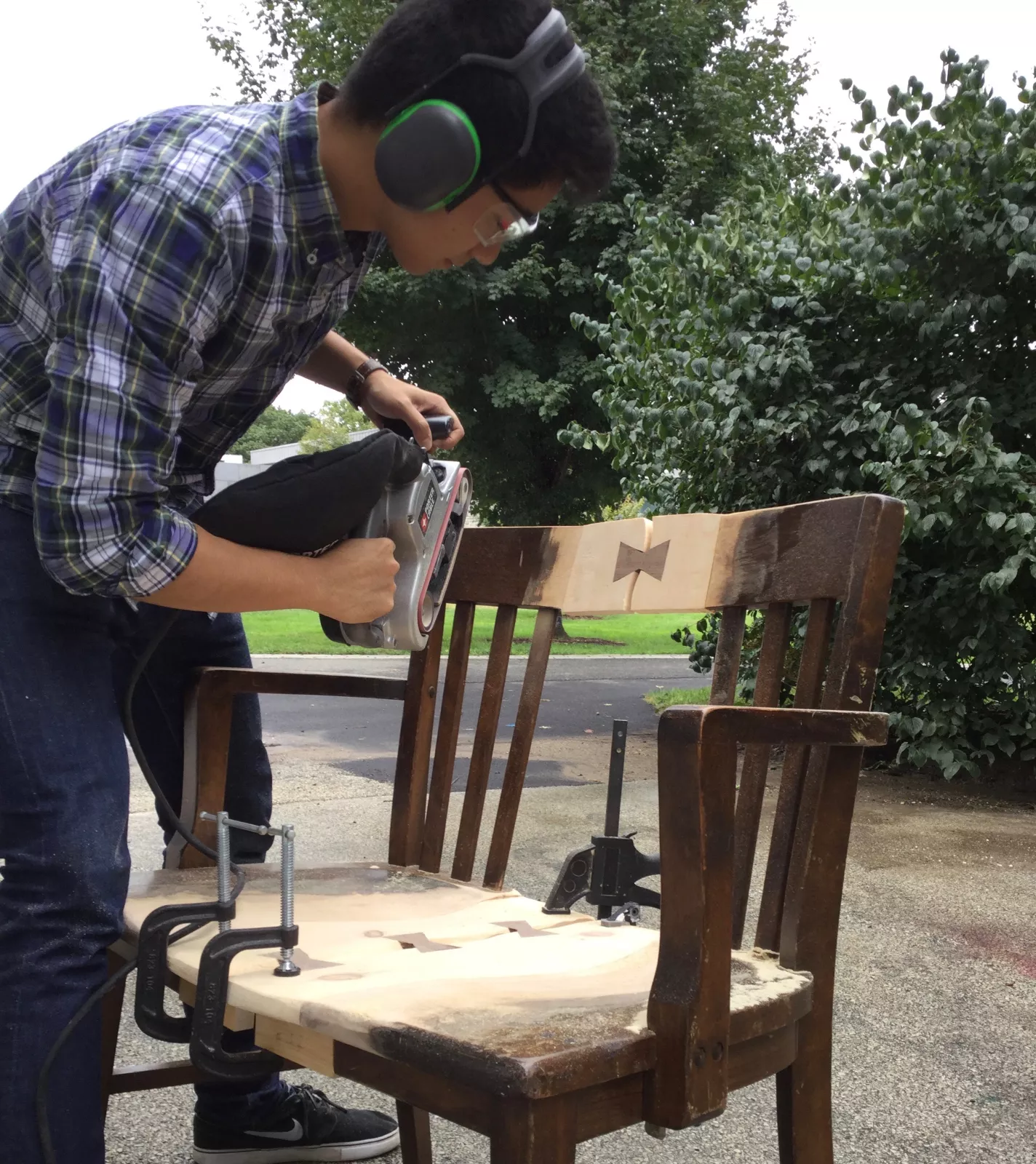 Student sanding down butterfly joints