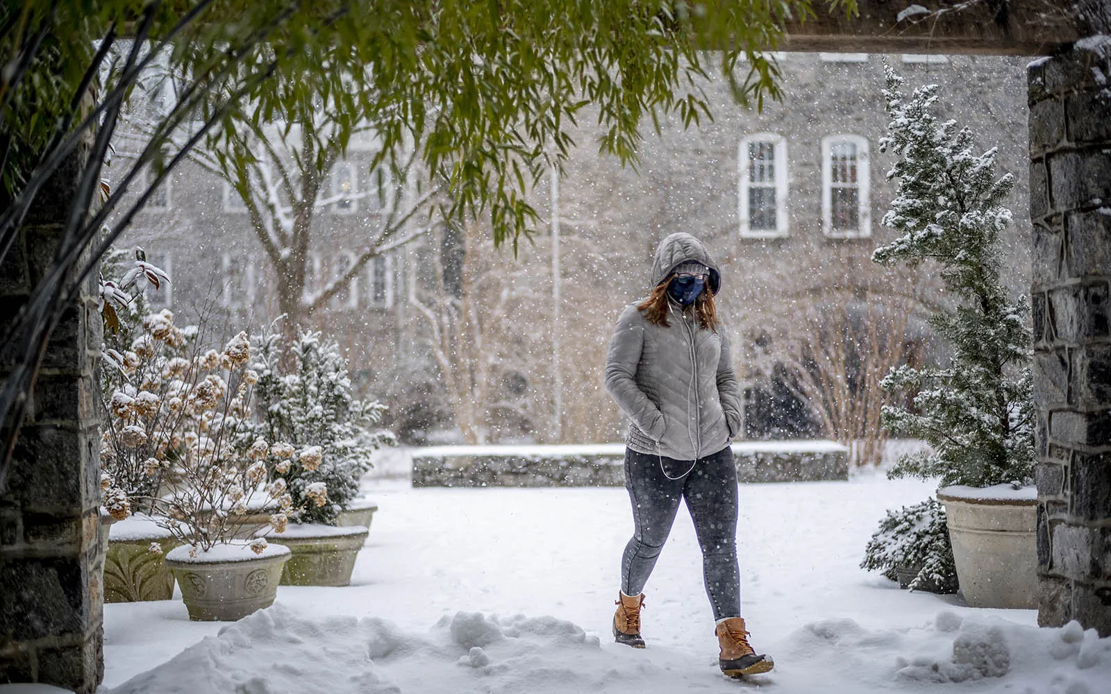 student walking in snow