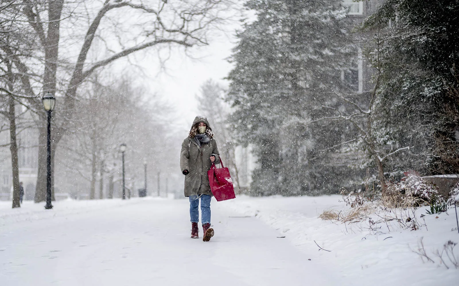 student walking in snow