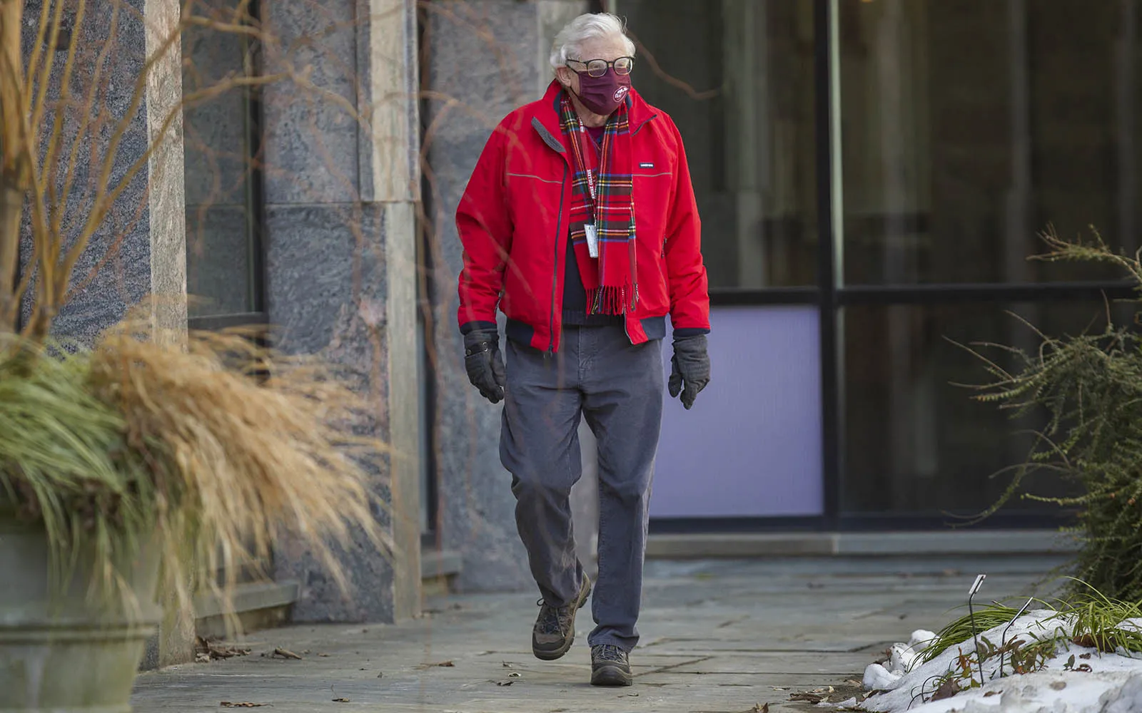 faculty member walking in snow