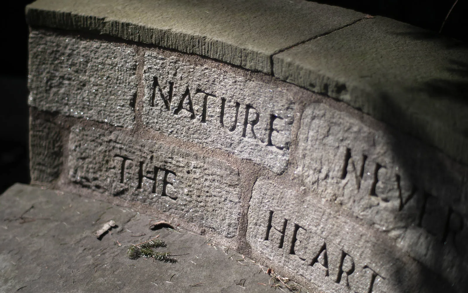stone bench with inscription carved into back