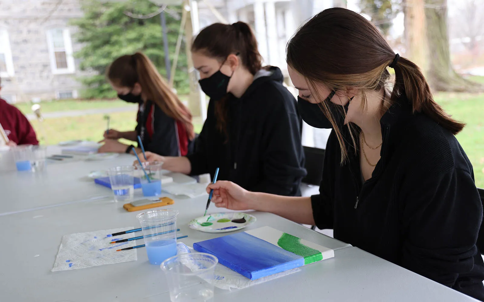 students painting watercolors
