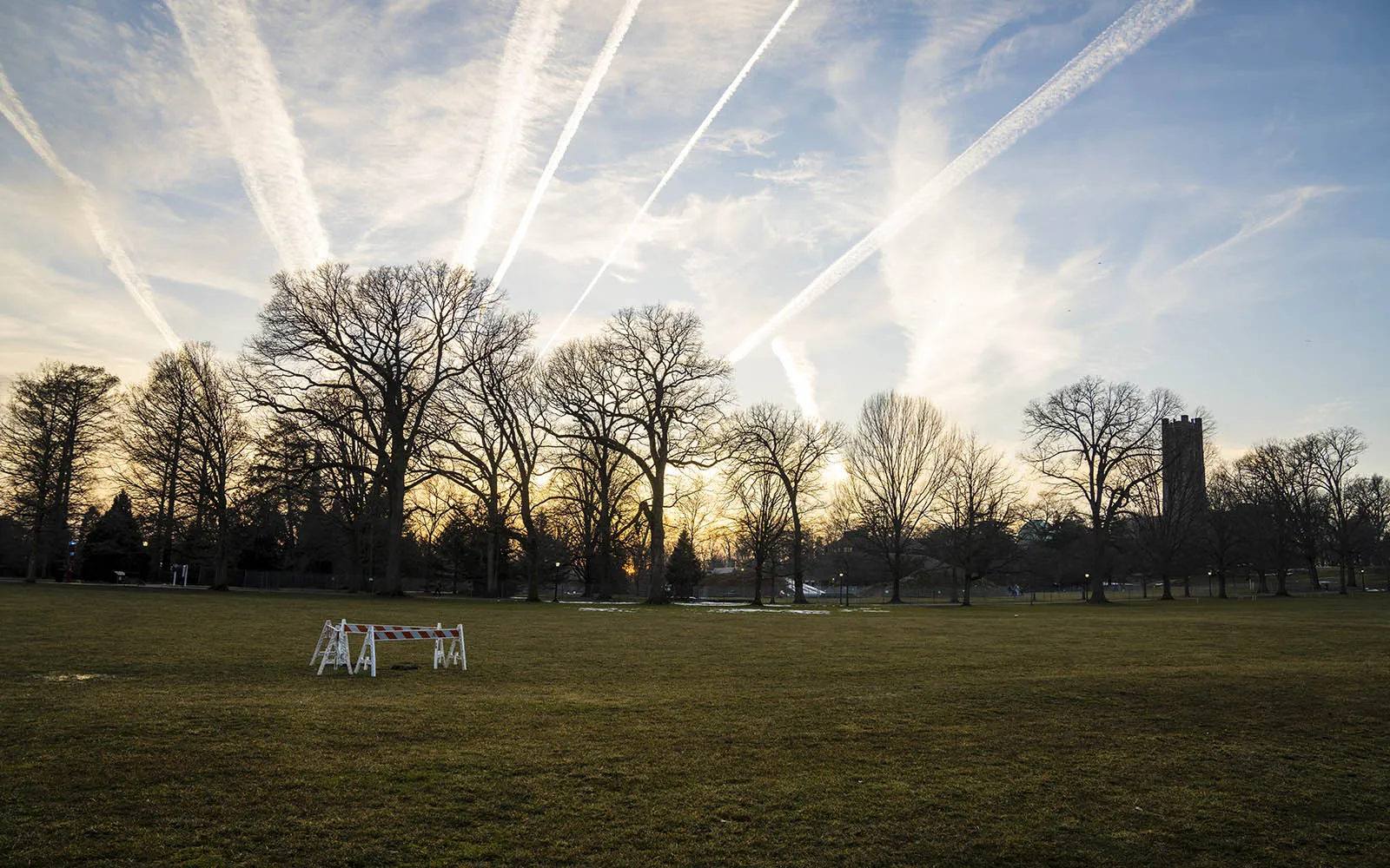 airplane contrails in the sunset sky