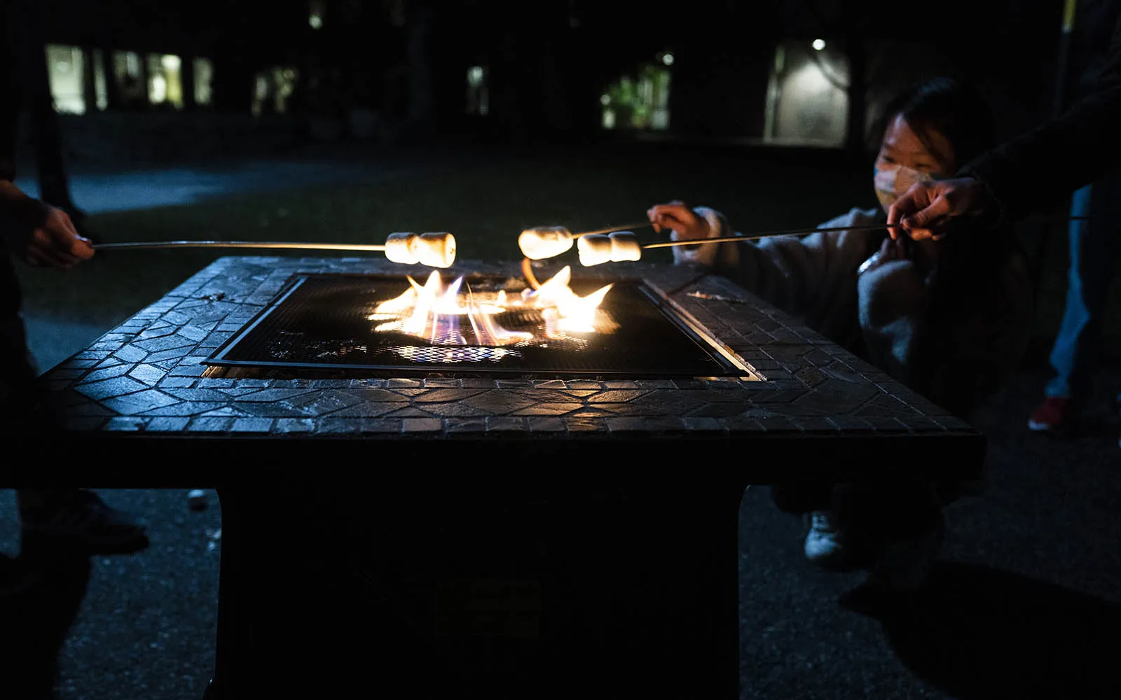 students roasting marshmellows