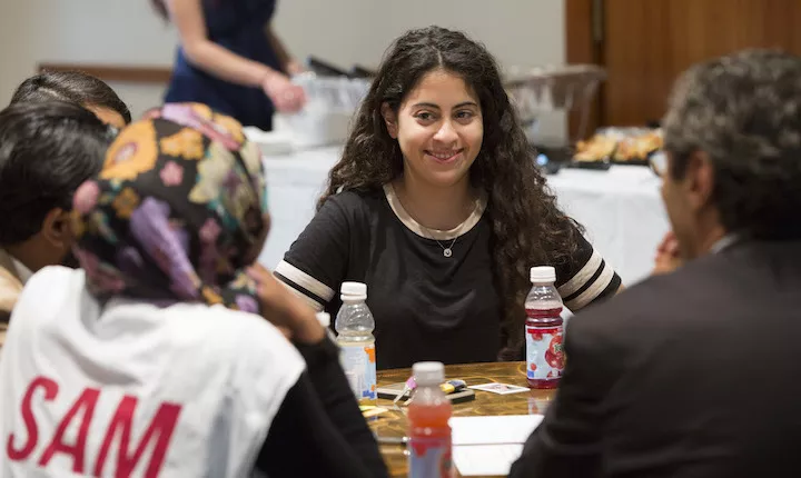 student at table