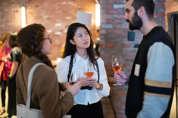 Young alumni mingle at an event in New York City