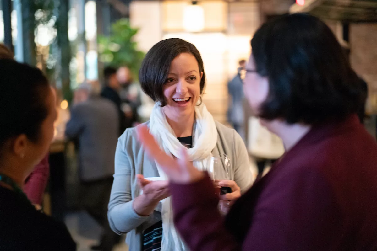 Alumni mingle during an event in New York City