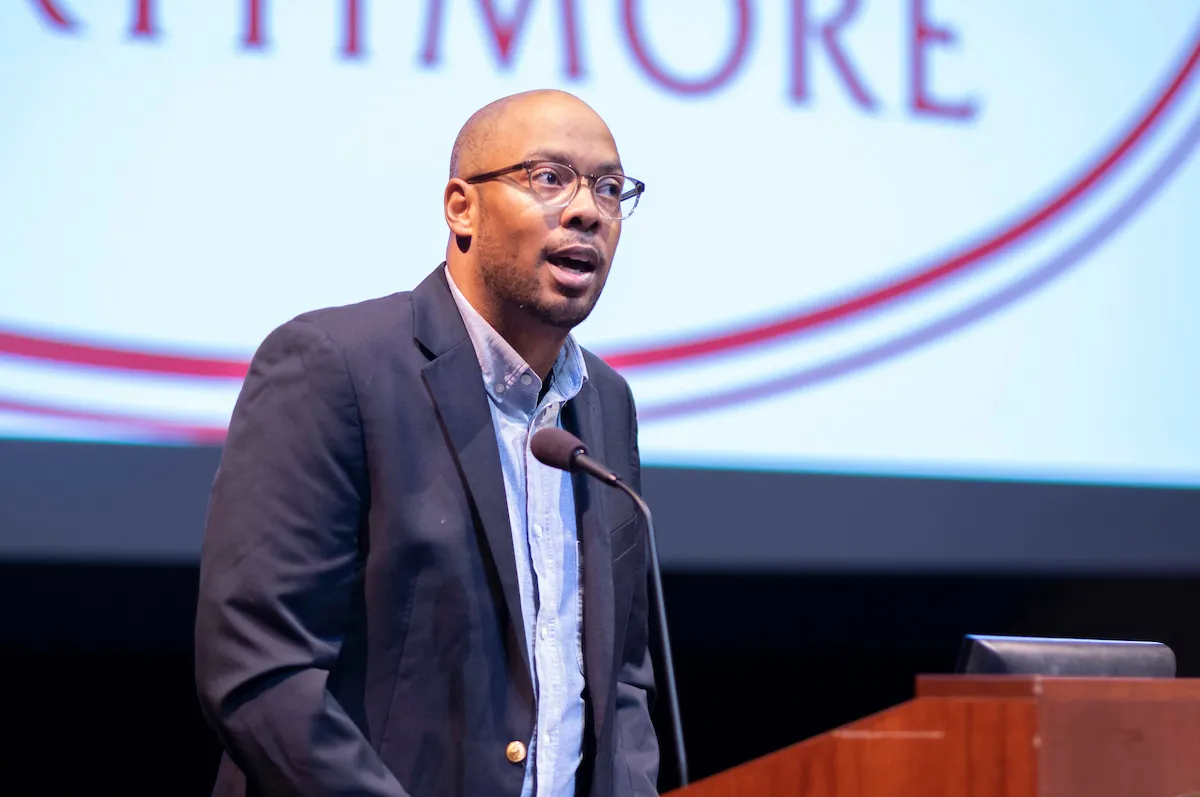 Speaker at podium during orientation event