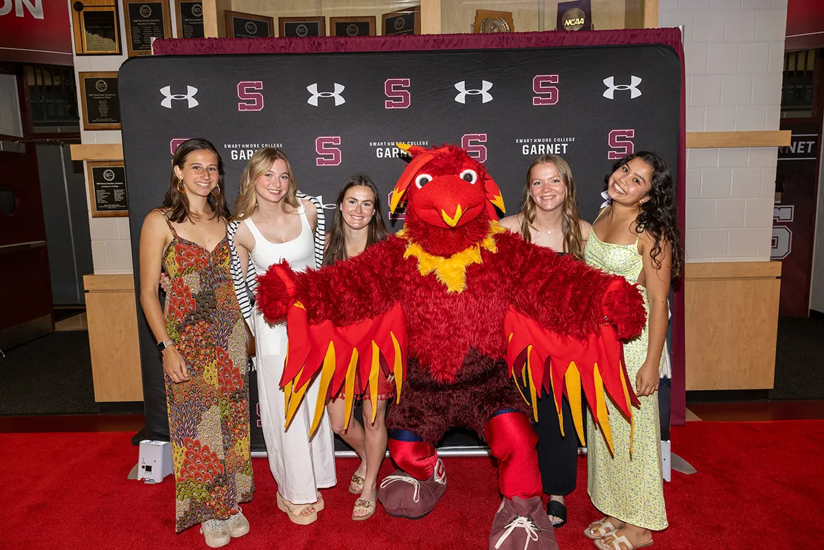 Student-athletes pose with Phineas the Phoenix
