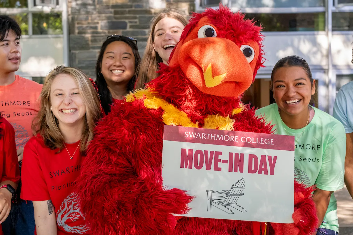 Phineas the Phoenix with students during move-in