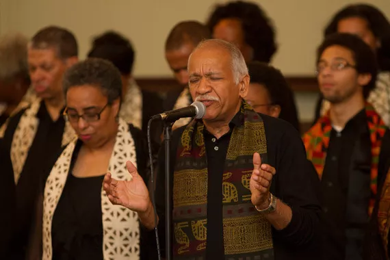 Gospel choir members praying