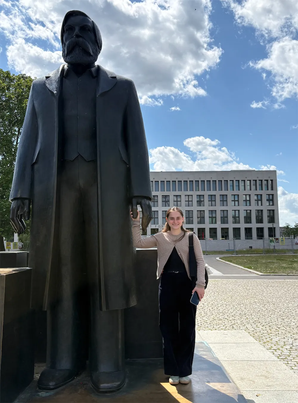 Katie Kerman with statue of Friedrich Engels