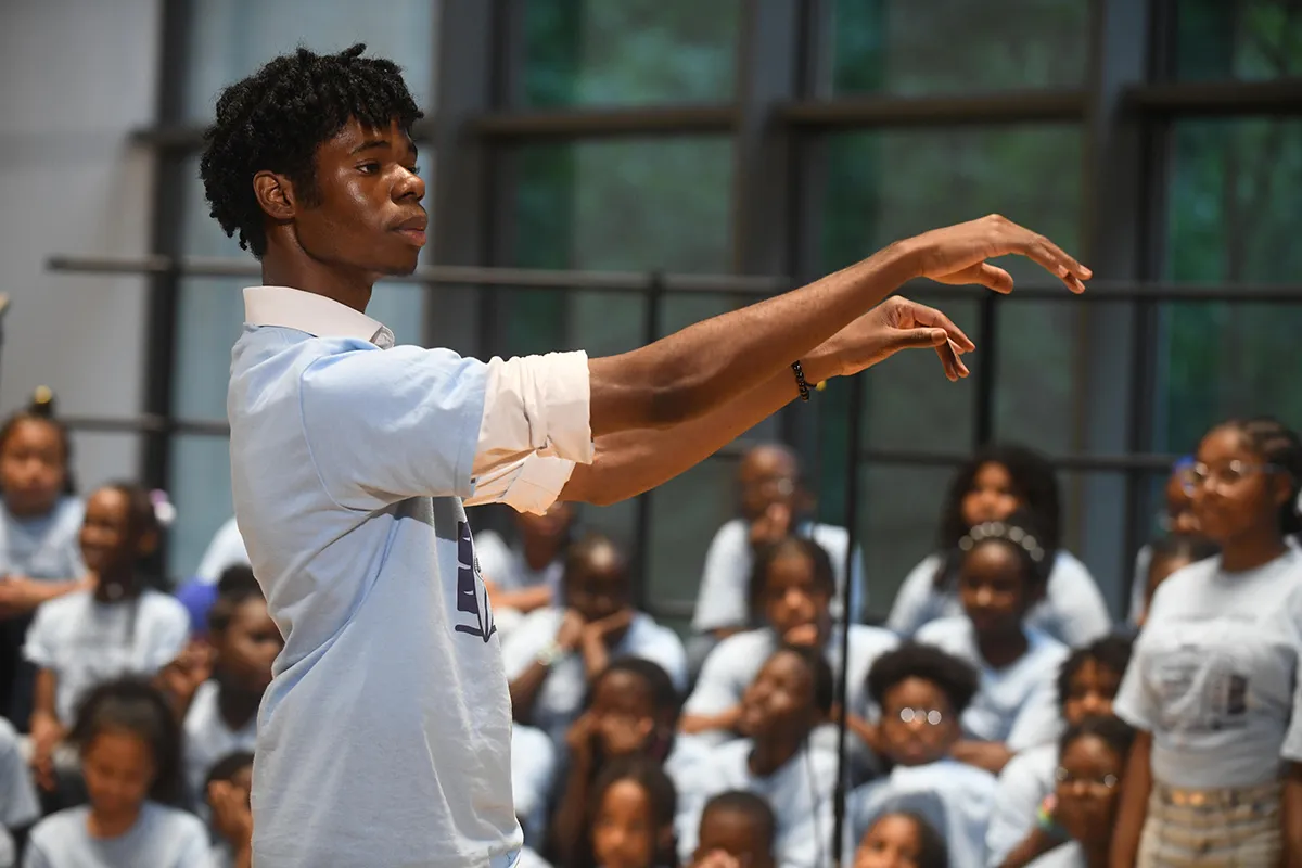 Student conducts CCC performance