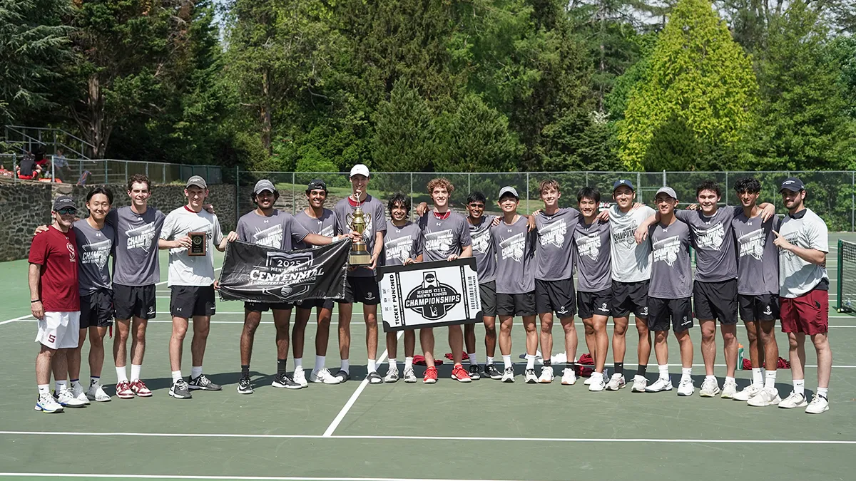 Men's tennis team poses with centennial conference trophy