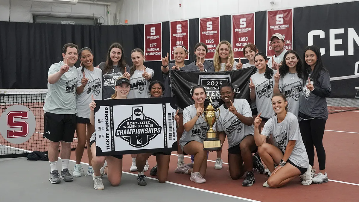 Women's tennis team poses with centennial conference trophy