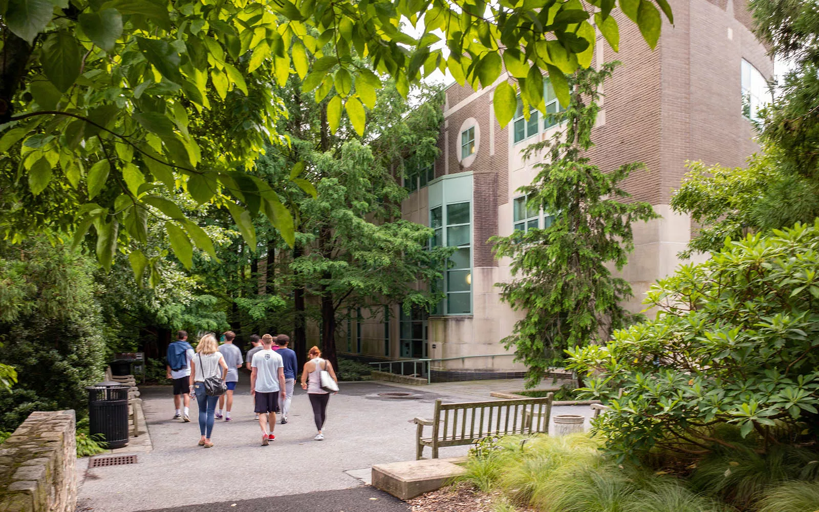 People walking outside of the Lang Performing Arts Center
