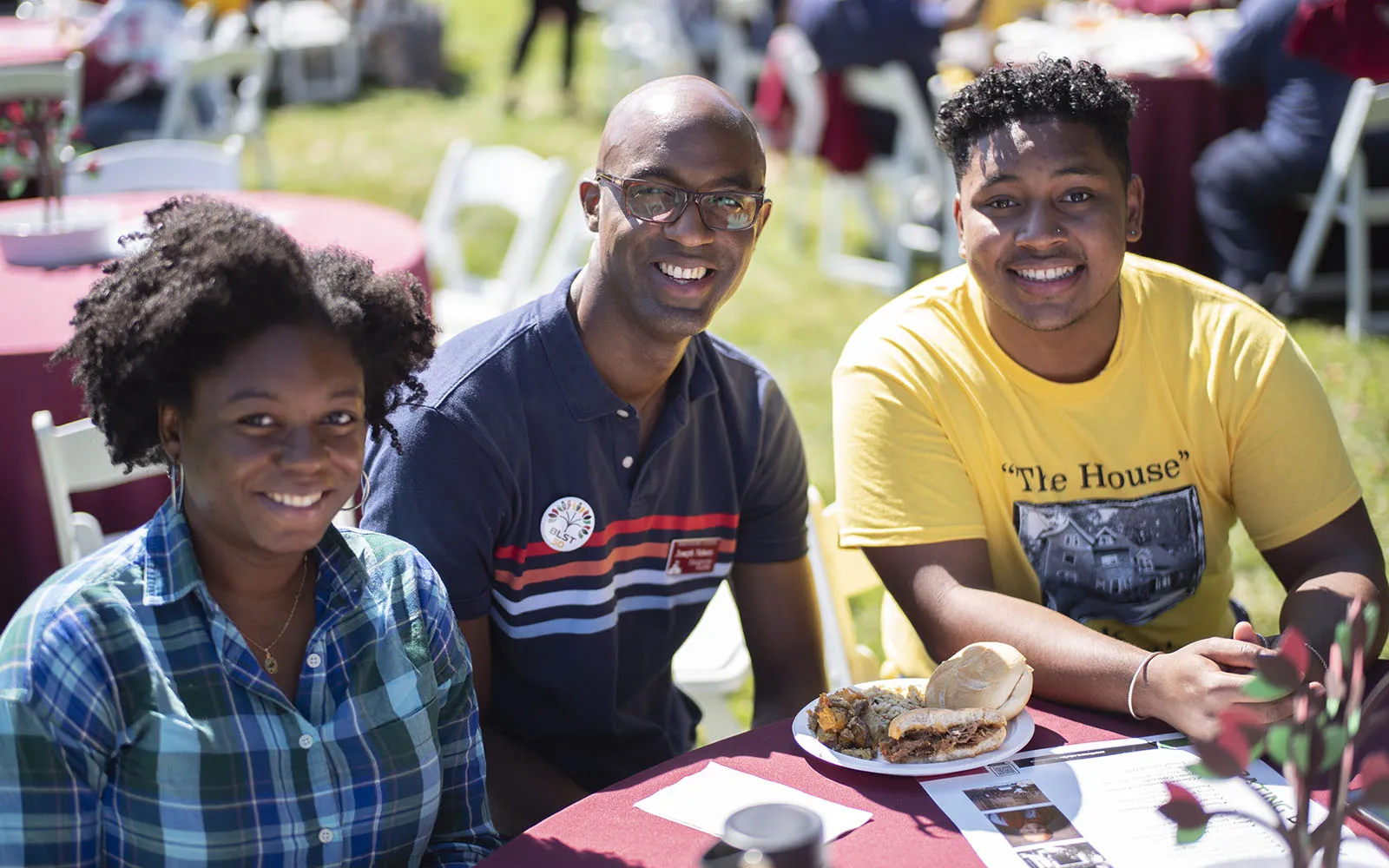 three people sitting at table