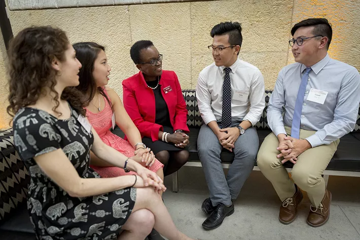 President Smith speaks with students in Philadelphia.