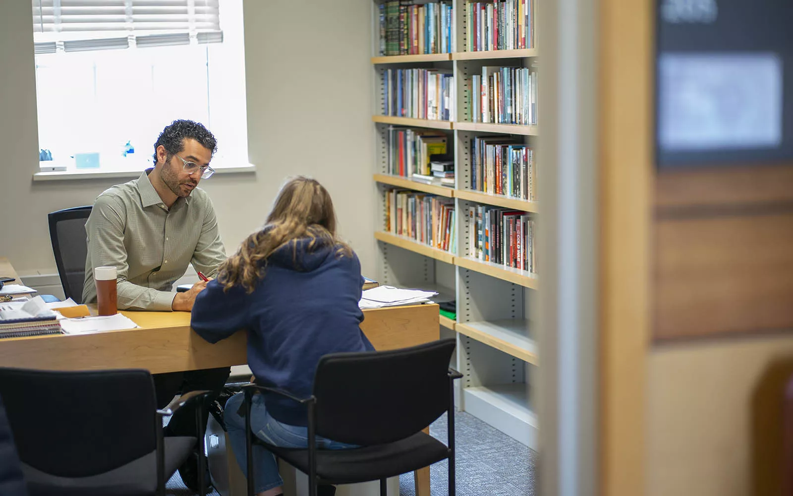 professor talking with a student