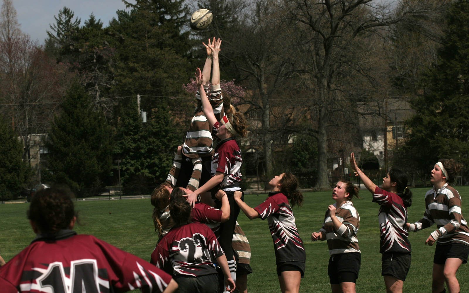 female students in a rugby match