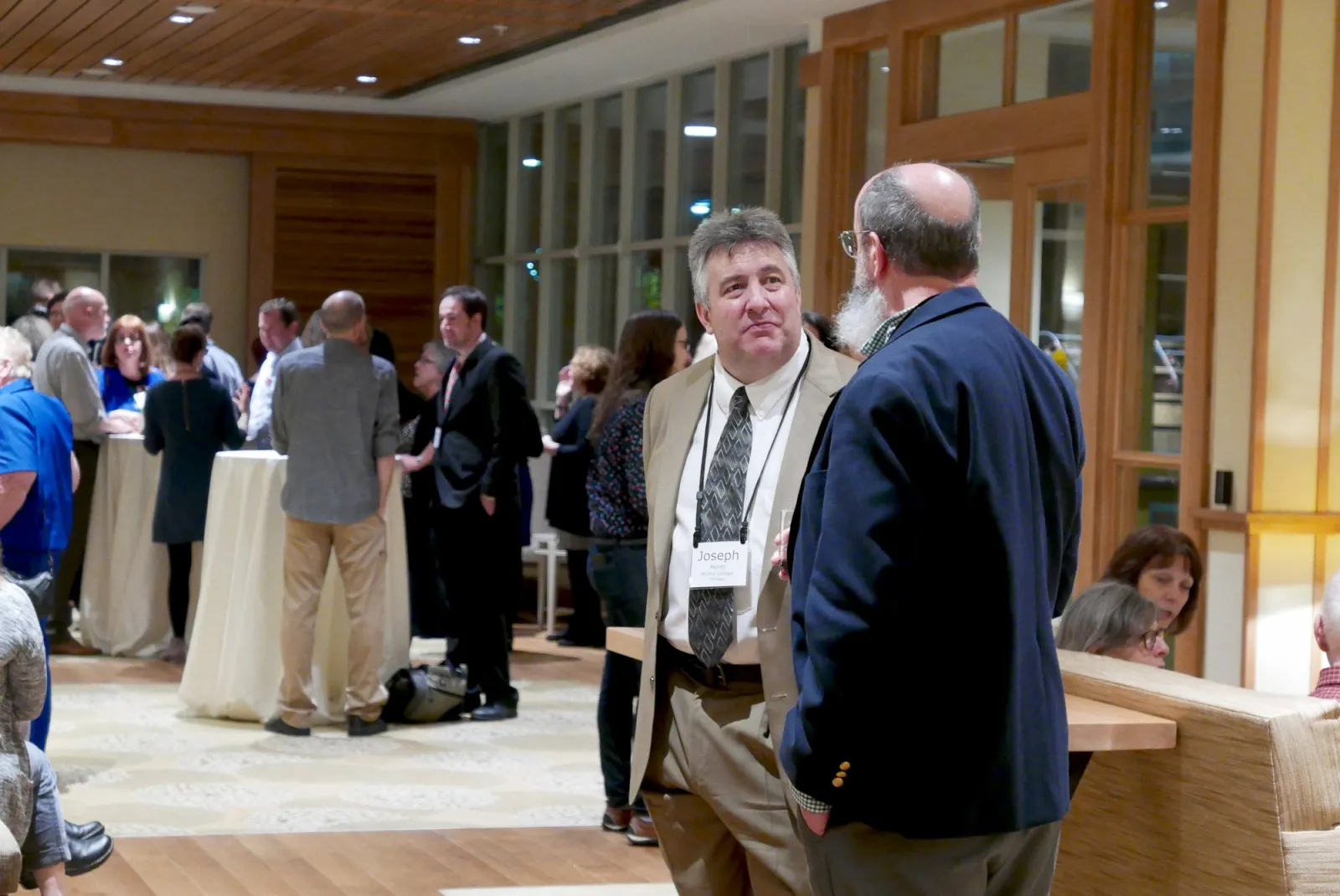 Clasp conference attendees in conversation at the Inn